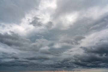 Fototapeta na wymiar Dark cumulus thunderstorm clouds background
