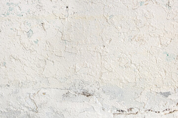 abstract background of an old shabby painted white wall close up