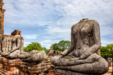 Fototapeta na wymiar The broken Buddha statue in Wat Chaiwatthanaram. A Buddhist temple in the city of Ayutthaya Historical Park, Thailand, on the west bank of the Chao Phraya River. was constructed in 1630 by the king. 