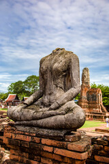 The broken Buddha statue in Wat Chaiwatthanaram. A Buddhist temple in the city of Ayutthaya Historical Park, Thailand, on the west bank of the Chao Phraya River. was constructed in 1630 by the king. 