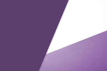 Plain vs textured dark deep shades of purple and white color papers intersecting to form a triangle shape for cover design