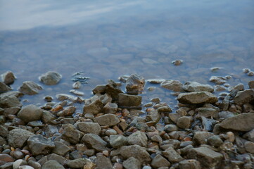 The river bank in the evening. Rocks on the coast.
