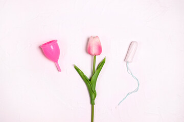 Obraz na płótnie Canvas Tampon, menstrual cup and tulip on a white background.