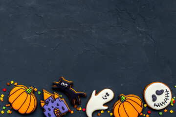 Funny halloween cookies and sweets flat lay, top view