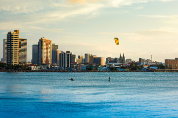 Sunset on the sea of Fortaleza with silhouette of a shipwreck