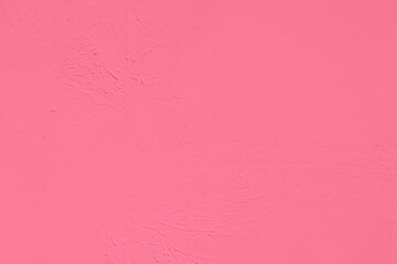 Saturated pastel pink colored low contrast Concrete textured background. Empty colourful wall texture with copy space for text overlay and mockups. 2023, 2024 color trend