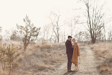 Couple walking in a spring field