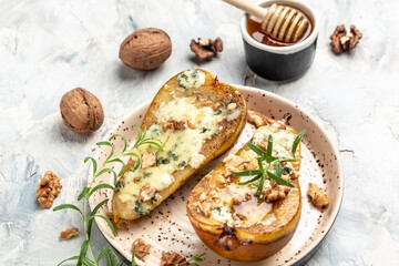 Pears baked with blue cheese, nuts, honey. French cuisine. Vegetarian lunch. banner, menu, recipe place for text, top view