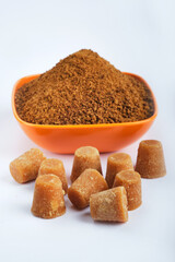 Organic Gur or Jaggery Powder and cubes, Jaggery is used as an ingredient in sweet and savoury dishes in the cuisines of India.