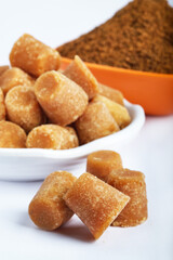 Organic Gur or Jaggery Powder and cubes, Jaggery is used as an ingredient in sweet and savoury dishes in the cuisines of India.