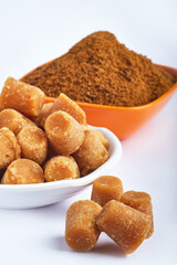 Organic Gur or Jaggery Powder and cubes, Jaggery is used as an ingredient in sweet and savoury dishes in the cuisines of India.