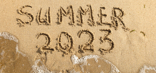 Summer lettering on the beach.