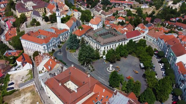 Veszprem, Hungary - 4K flying over the medieval district of Veszprem Ovaros square on a bright summer day with clear blue sky