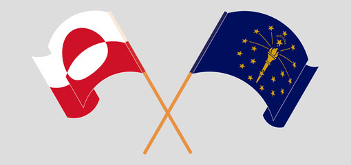 Crossed and waving flags of Greenland and the State of Indiana