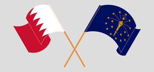 Crossed and waving flags of Bahrain and the State of Indiana