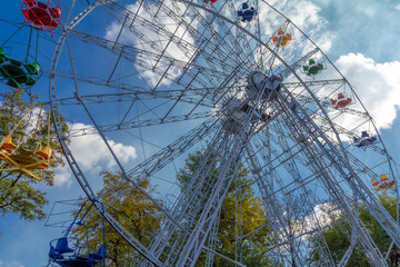 Ferris wheel with the blue sky background