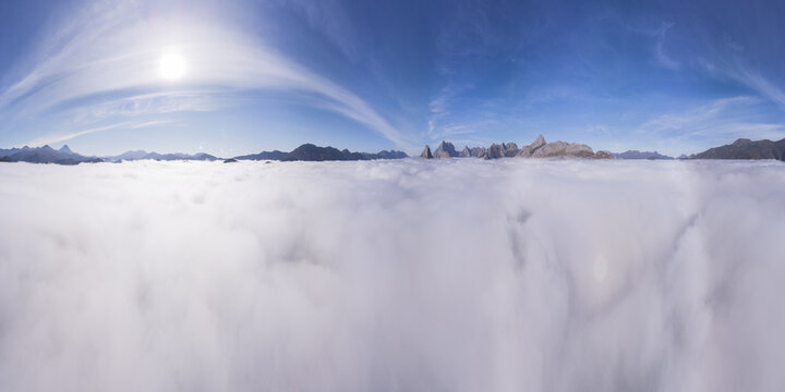 Clouds against mountains and blue sky