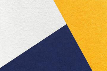 Fototapeta na wymiar Texture of craft white, yellow and navy blue shade color paper background, macro. Structure of abstract cardboard