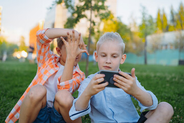 Obraz premium cute funny children shooting selfie with smartphone
