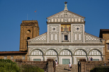 Florence, Italy - July 23 2022:Basilica of San Miniato al Monte, from whose square you can admire the famous Tuscan city from above