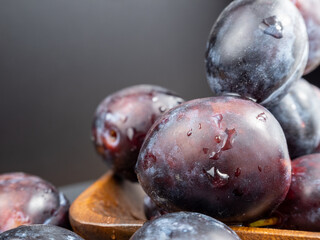 Fresh juicy plums. Plums on a black background.