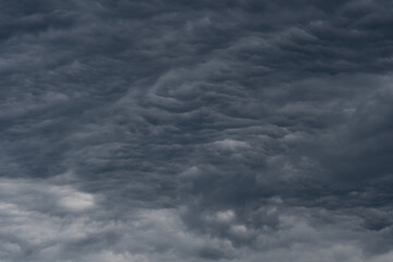 Rain clouds background. The clouds turn dark gray, like big smoke before rain.