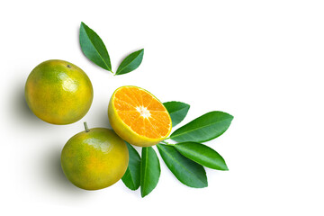 Tangerine orange fruit with half slice and green leaves isolated on white background. Top view....