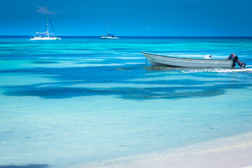 Tropical paradise: idyllic beach with boats, Punta Cana, Dominican Republic
