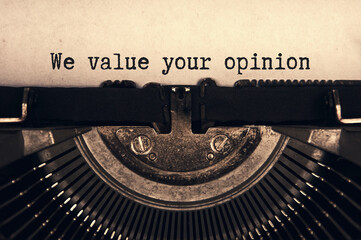We value your opinion text typed on an old vintage typewriter in black and white