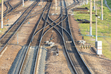 A railway junction with crossing parallel railroad tracks. Perspective view of railway tracks...