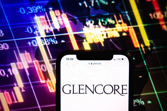 KONSKIE, POLAND - August 09, 2022: Smartphone displaying logo of Glencore company on stock exchange chart background