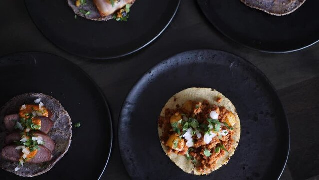 Tacos dishes are displayed in a fancy Mexican restaurant