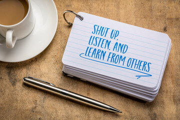 shut up, listen, and learn from others advice - handwriting on an index card with a cup of coffee, communication, learning and personal development concept
