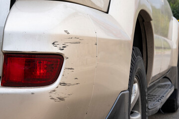 Damage to the paintwork of the car, Scratches on the bumper after a collision.