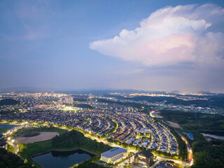 Aerial view of baseball field and lights from suburban community at night
