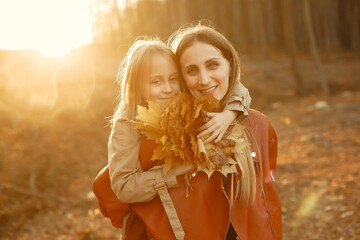 Cute and stylish family in a autumn park