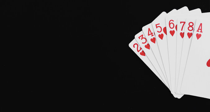 Royal Flush Playing Cards On A Black Background.