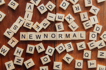 wooden blocks for new normal words The world is changing to bring back the normalcy of business,...