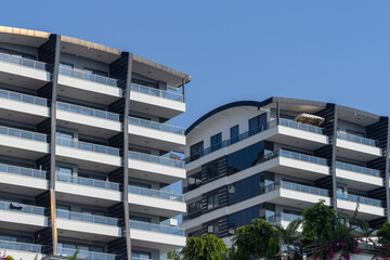 A modern residential complex consisting of several apartment buildings.