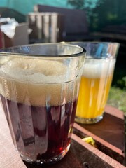 glasses with dark beer and light beer