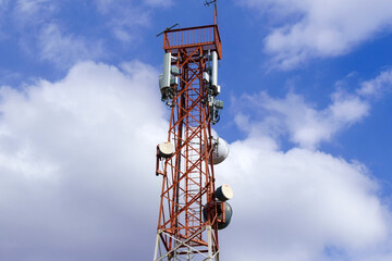 Working at 5g antenna tower for maintaining. Serves cellular antenna, technician worker repair telecommunication tower. Copy space