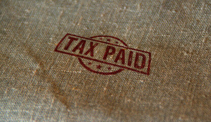 Fototapeta na wymiar Tax paid and taxation stamp and stamping