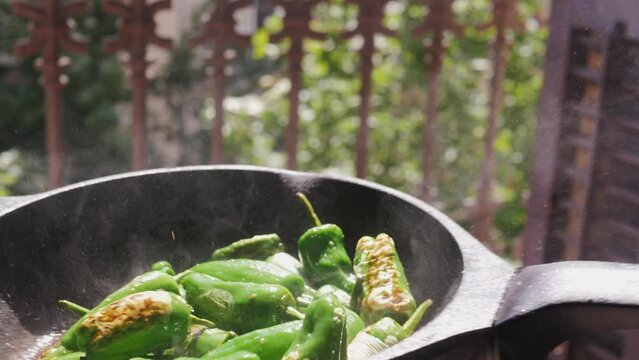Traditional Spanish patron peppers, green padrons tapas.