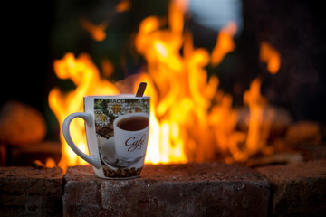 A cup of aromatic coffee, open air breakfast