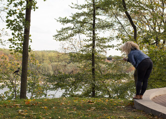 Selfie in the forest, a girl in nature with a mobile phone