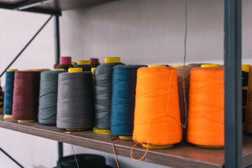 Threads of different colors in the workshop