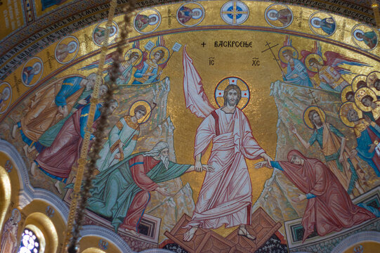 Interior photographs allowed because artwork is formed from tiny colored pieces of glass. No paintings. This artwork is above looking at the ceiling at St Sava Orthodox Christian Church or Temple.
