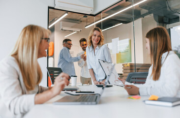 Fototapeta premium Working with project. Group of professional business people is in the office