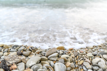 Fototapeta na wymiar Seashore with pebbles. Sea, beach, rest and vacation travel.