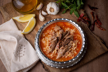 Turkish Soup Beyran with Lamb Meat, Rice, Chopped Garlic and Vinegar Sauce. Traditional Organic Food. Traditional soup of Gaziantep, Turkey. (Turkish name; Beyran corbasi)
